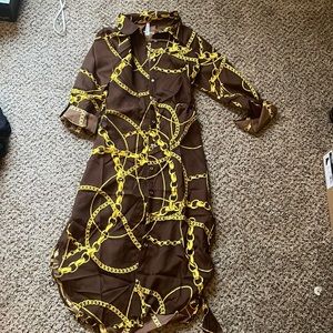 Brand new below the knee button down dress with collar and belt